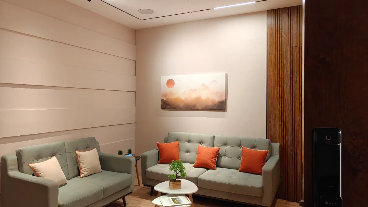 Live home automation demonstration in the experience center living room zone — lighting scenes, climate and curtain control